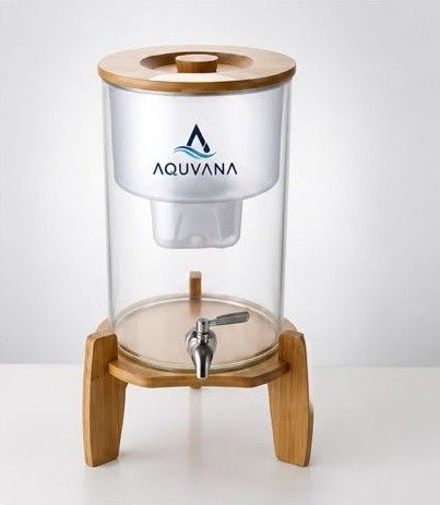 Aquvana countertop water filter on a wooden stand